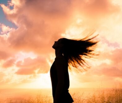 Woman feeling free in a beautiful natural setting.