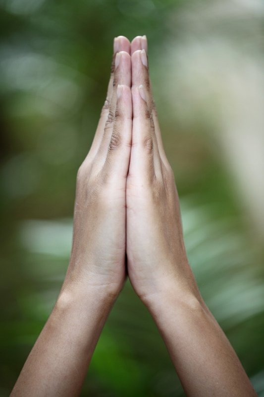 Closeup view of praying hands