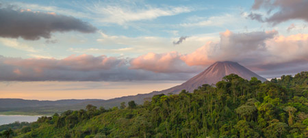 Arenal Volcano at Sunrise in Costa Rica, as the sun reflects on