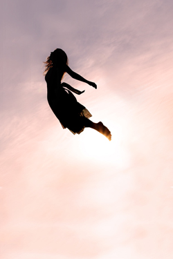 Silhouette of Woman Falling through Sky