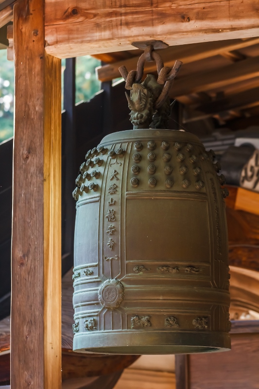 Kyoto, Japan - November 20 2013: The bells are hung around the temple to give signal for monks who stay at the Ryoanji temple